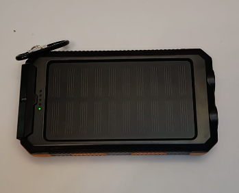 The solar power bank’s panel side, topping up its charge from the sun