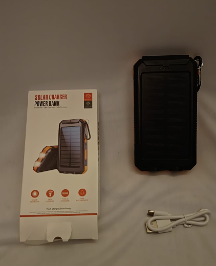 The solar charger power bank with its retail box and USB charging cable